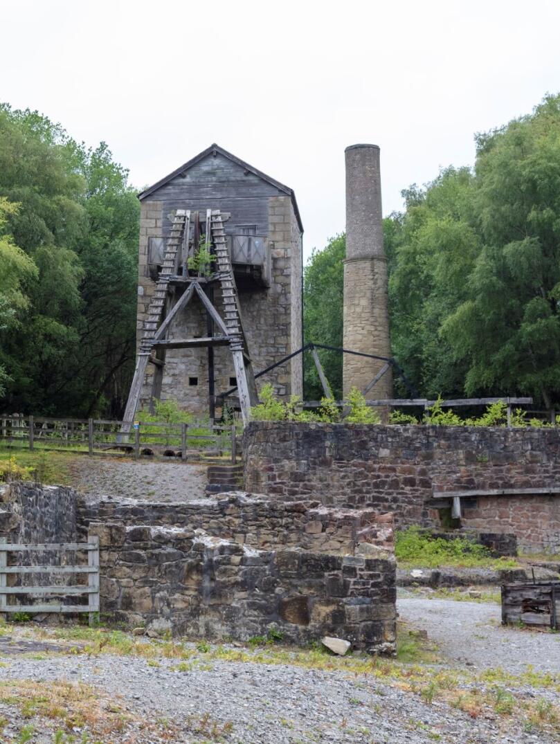 Winding wheel tower and chimney stack at a lead mine.