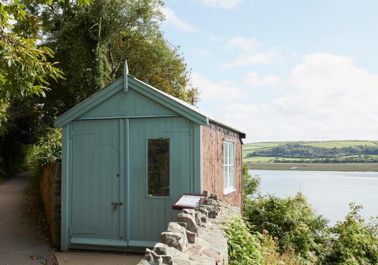 A writing shed looking out over an estuary.