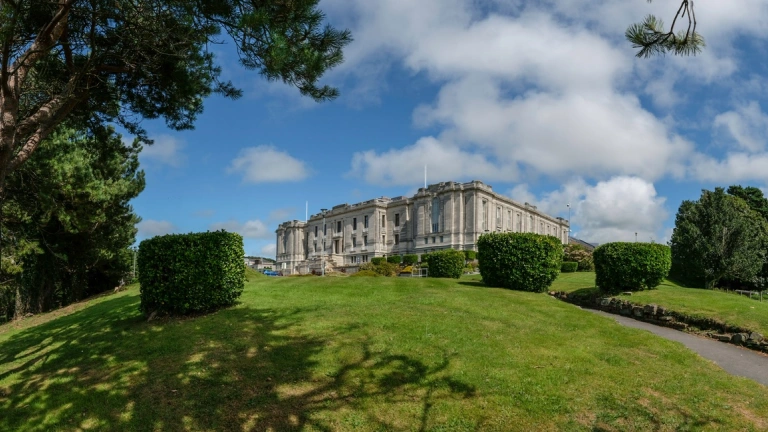 A national library amongst parkland and trees.