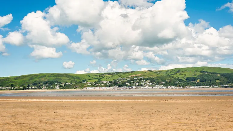 View across the beach towards a seaside resort.