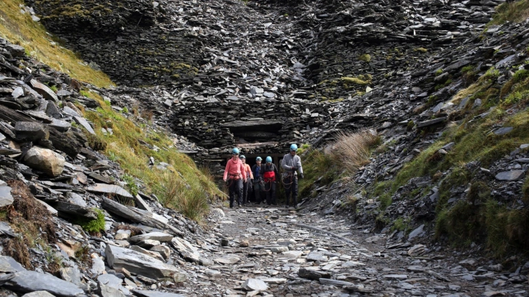 Adventure seekers at the entrance to the a slate mine.