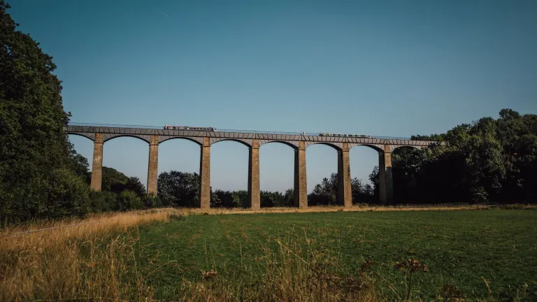 Boats travelling over an aqueduct.