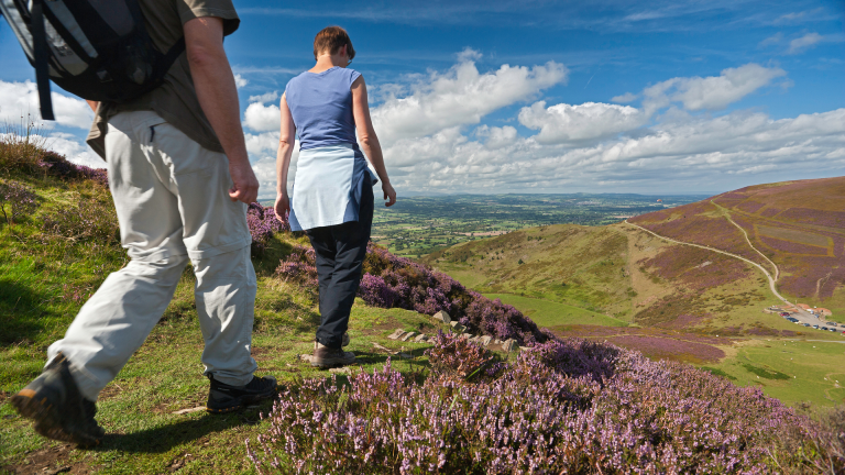 Couple walking on Moel Fenlli on the Clwydian Range.