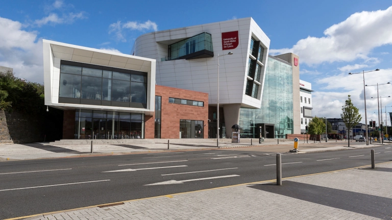 An external shot of the University of South Wales building in Cardiff in the sunshine.