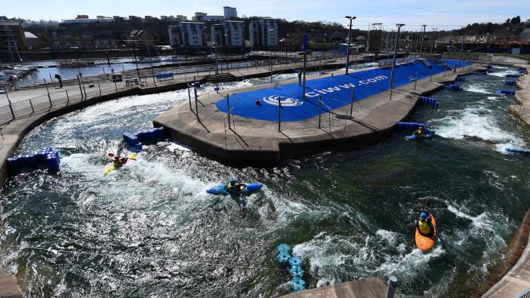 Kayakers riding the rapids at Cardiff International White Water.