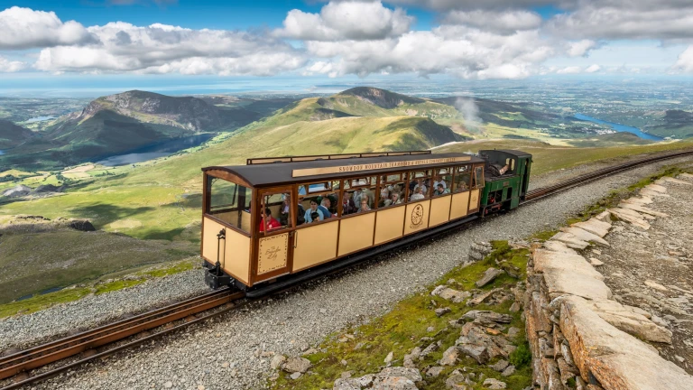 Snowdon Lily carriage going up the Snowdon Mountain Railway.