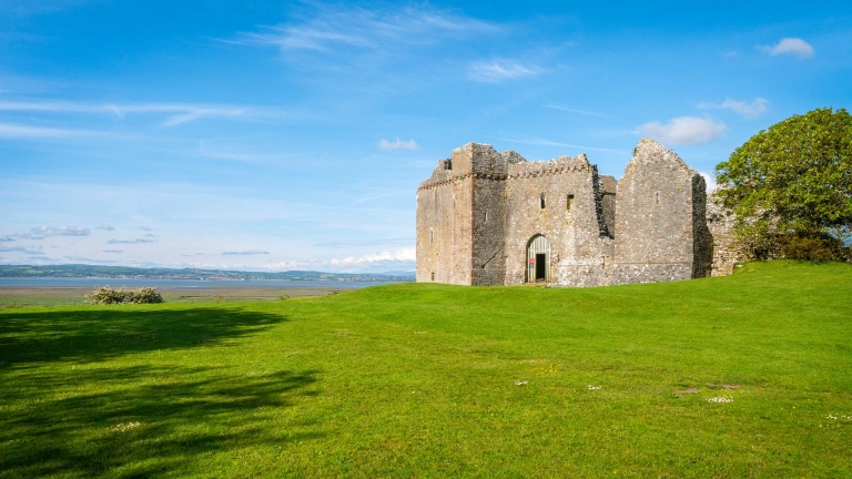 A castle with views of the bay beyond.