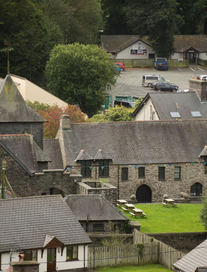 A shot from above of the back of  Owain Glyndŵr Centre and lawns.