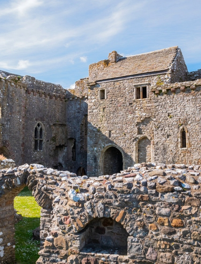 The inner courtyard of a well preserved stone castle.