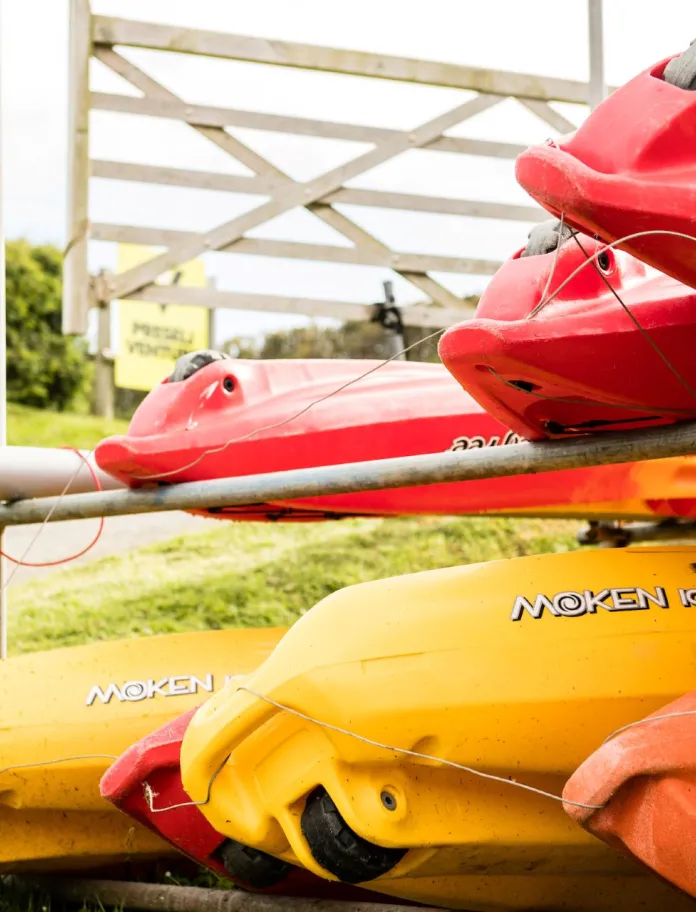 A stack of canoes at Preseli Venture.