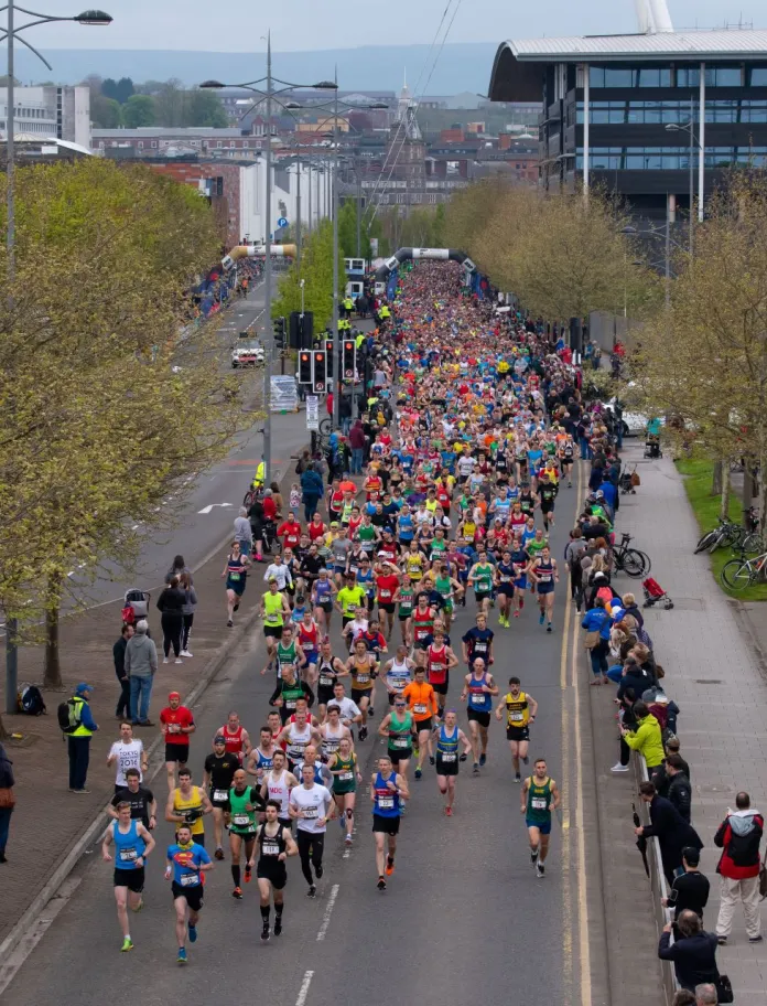 Athletes running at the start of Newport Marathon and 10K.