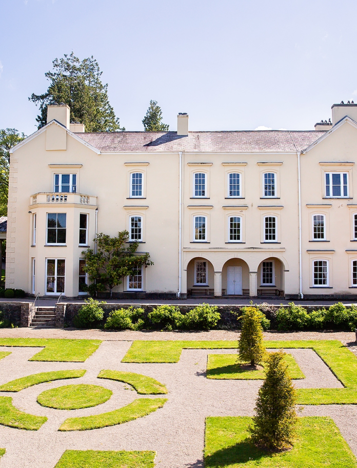 The exterior of Aberglasney House in Llangathen with garden in foreground
