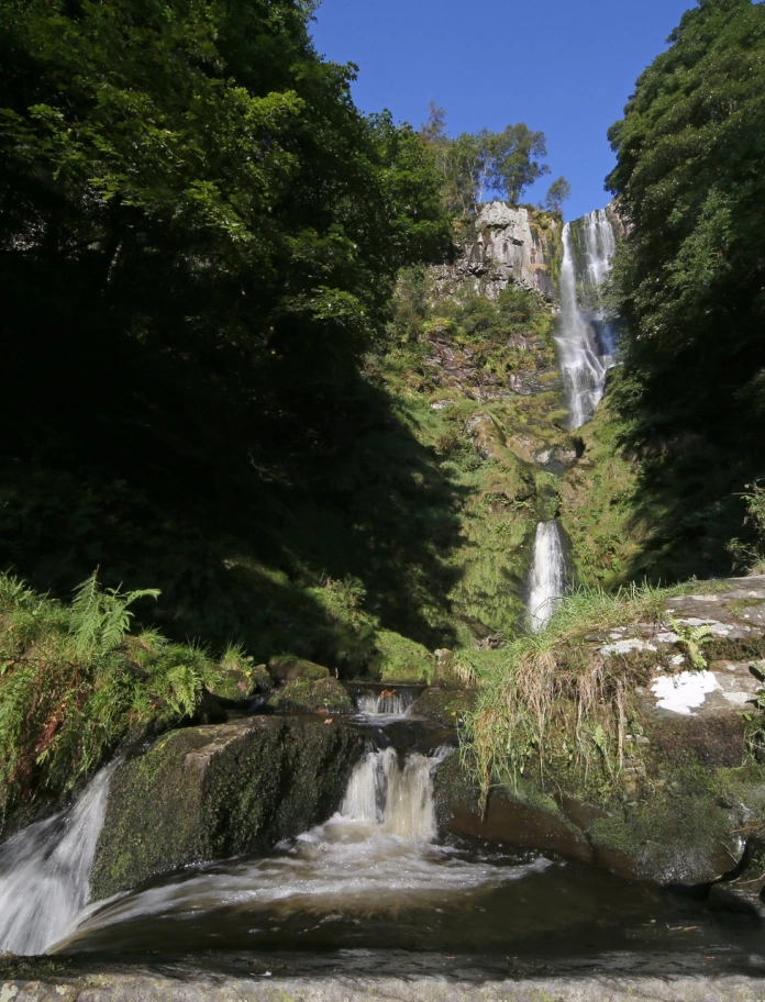 A waterfall cascading over rocks.