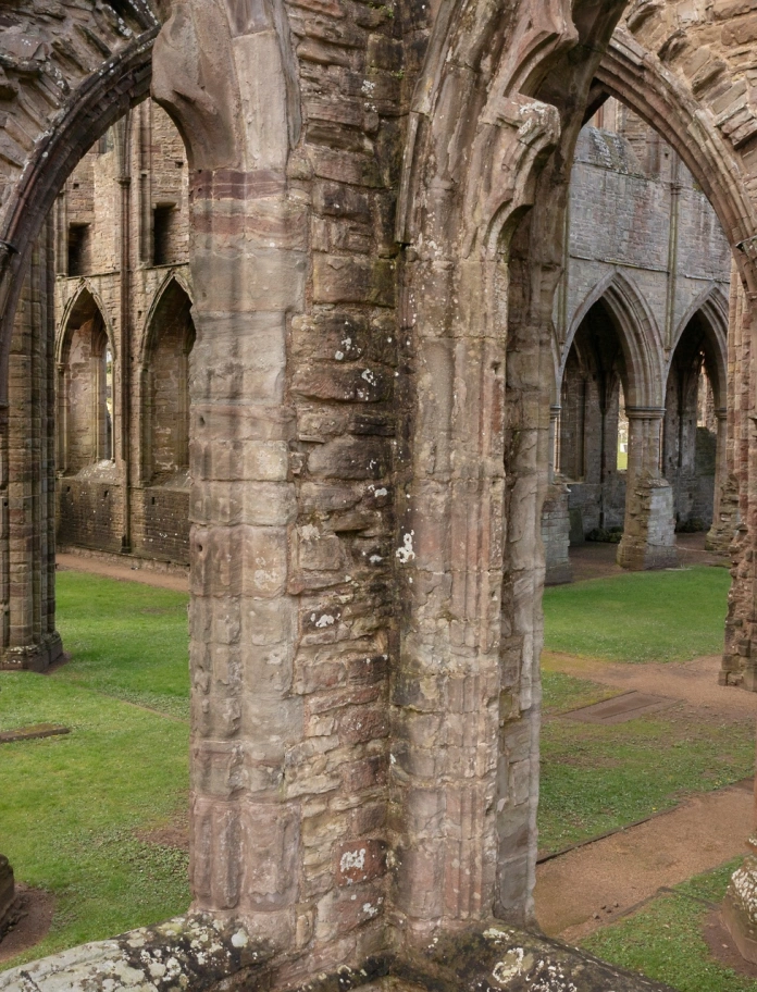 The pillars inside the ruins of an abbey.