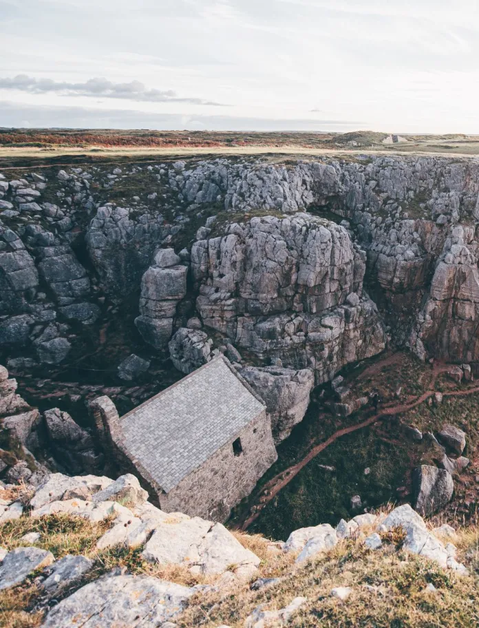 A chapel amongst cliffs on a coastline