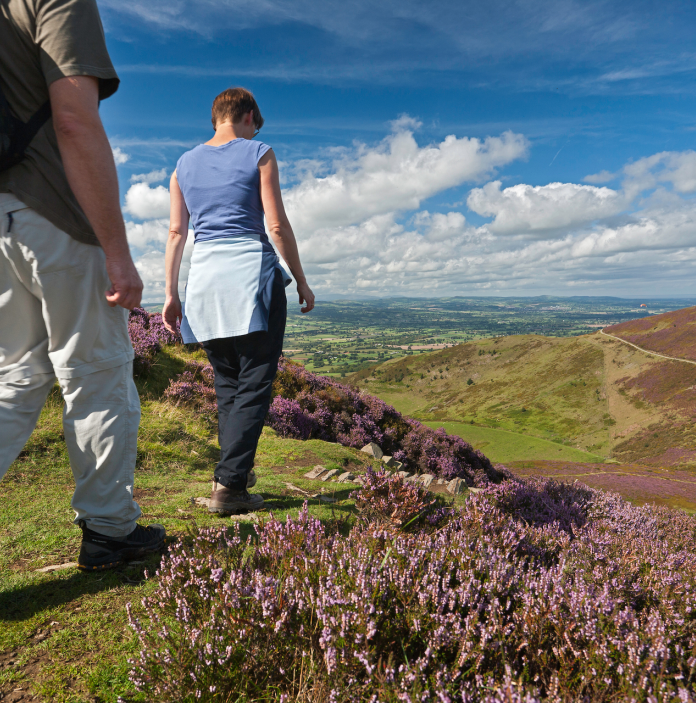 Couple walking on Moel Fenlli on the Clwydian Range.