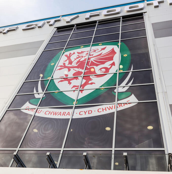 The emblem or Cardiff City Football Club on the glass fronted entrance.