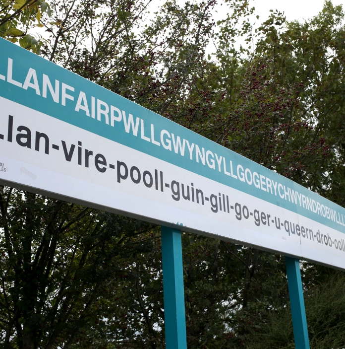Llanfair PG sign at railway station, with name in full.