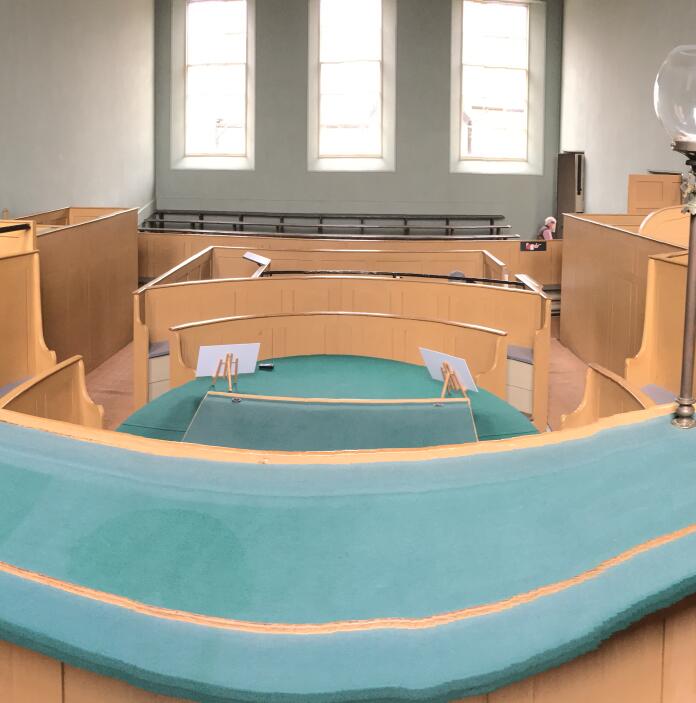 A small courtroom taken from the judge's seat.
