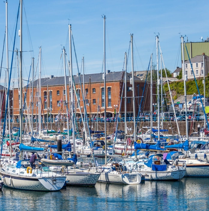 Boats and yachts moored in a harbour.