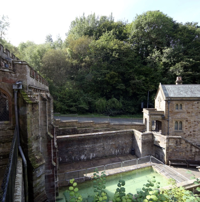 A chapel and holy well taken from a balcony.