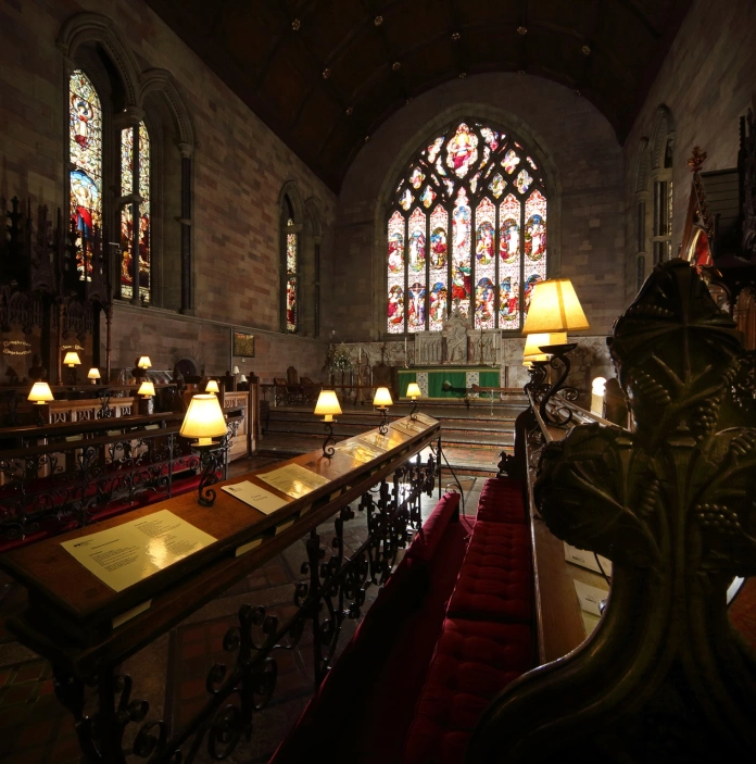 Stained glass windows and altar of a cathedral.