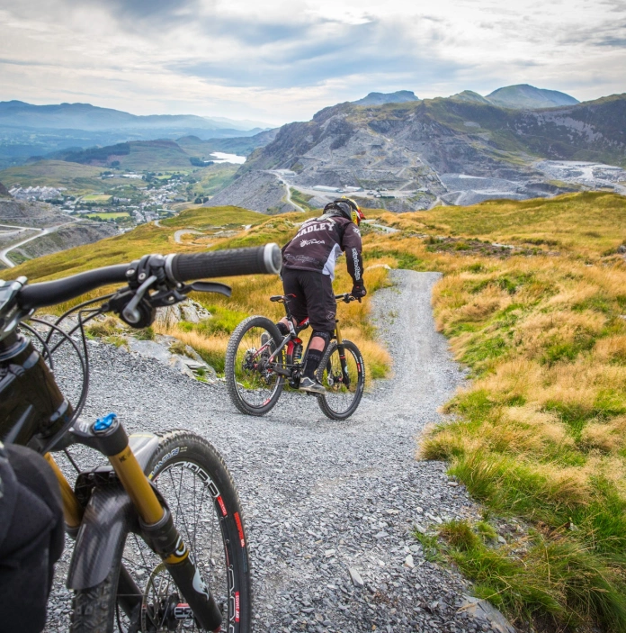 Mountain bikers about to start their downhill descent in a former quarry.