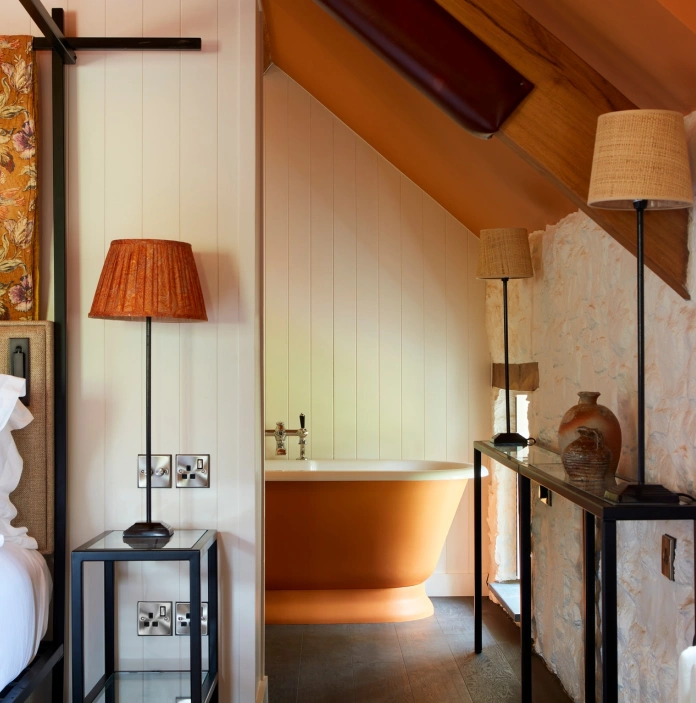 A bed and bath tub in a hotel