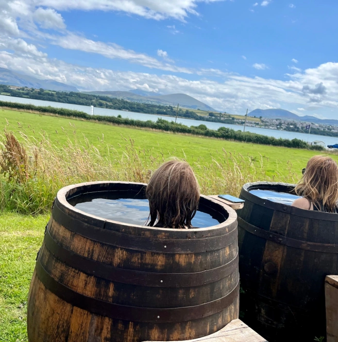 Ladies in barrels taking a seaweed bath overlooking the strait.