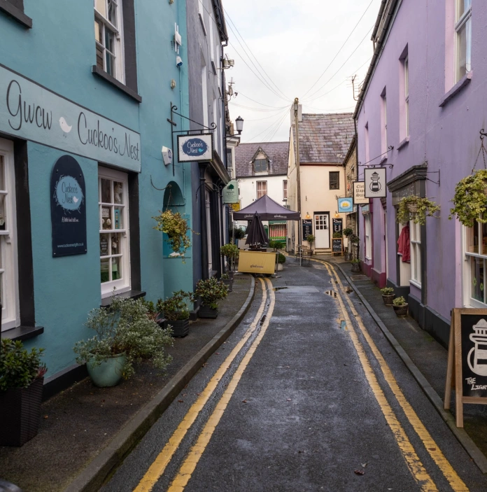 A street with colourful shops.