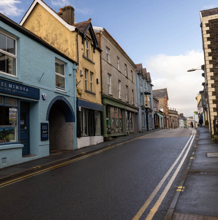A street with colourful shops.