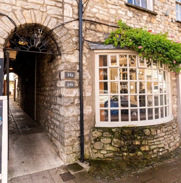A stone facade of a high street shop.