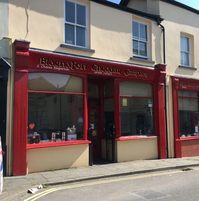 The front of a cheese making shop in a town centre.