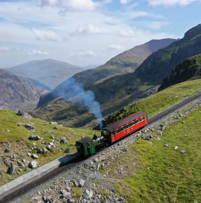 A diesel train climbing a mountain.