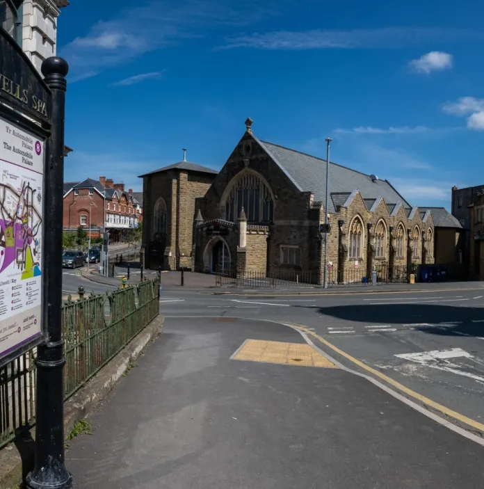 A map of a heritage trail with a church in the background.