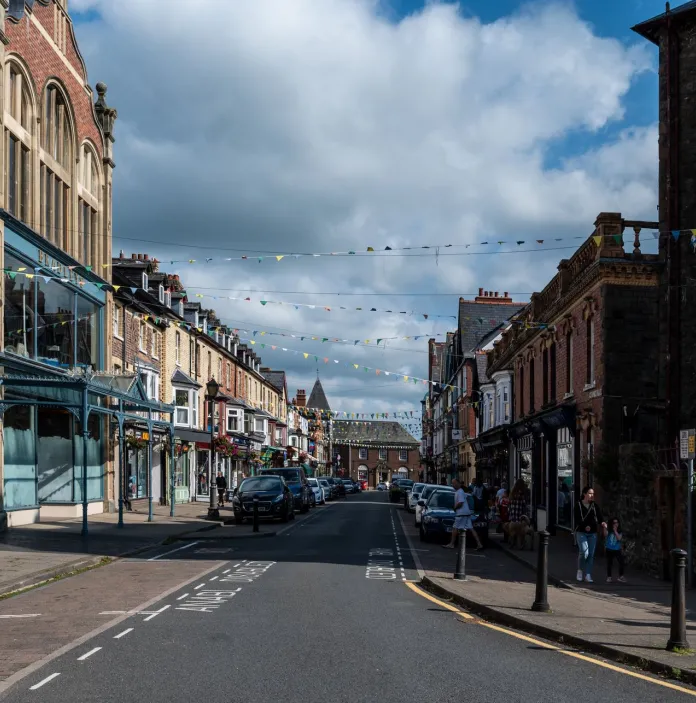 A town centre street draped with bunting.