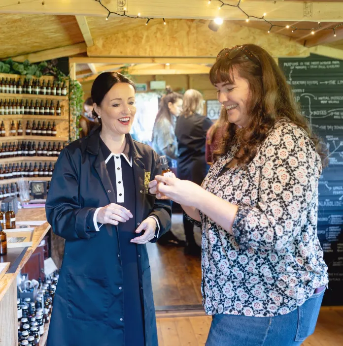 Group of people in a perfume-making workshop.