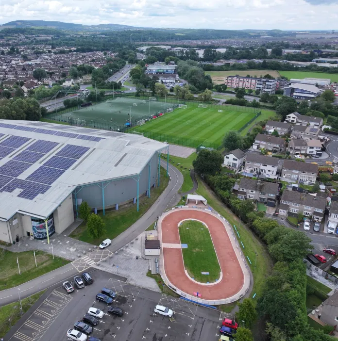 Aerial shot of a sports centre, fields and tracks.