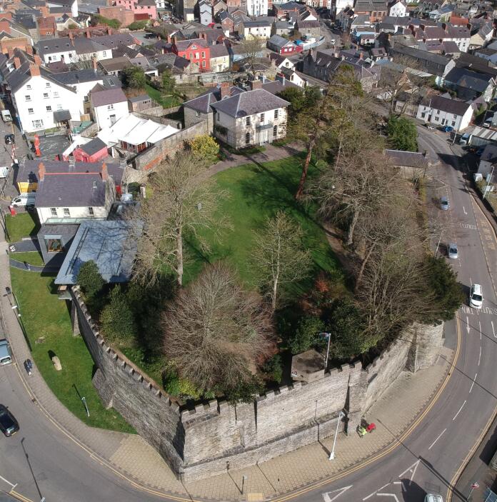 Aerial view of a castle in a town centre.