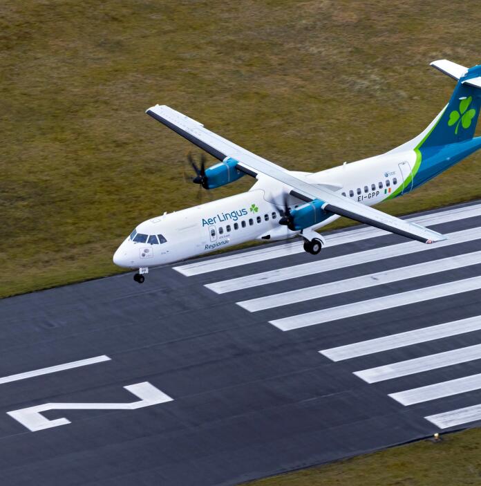 A passenger aeroplane landing at an airport.