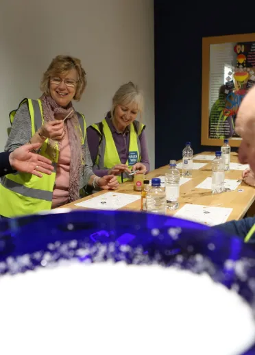 A group of visitors sampling the tastes of Halen Mon pure white sea salt.