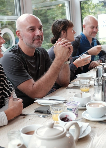 A group of people eating and drinking in Olif tapas bar