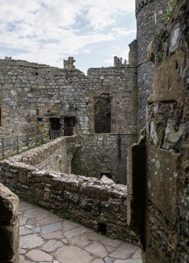 Stone walls and paths inside Harlech Castle.