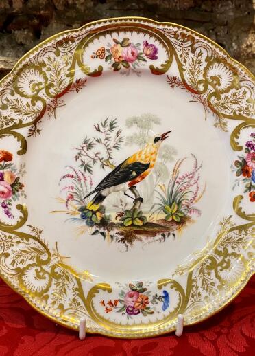 A porcelain plate featuring a bird.