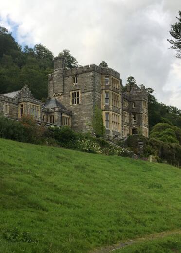 A grand house on a sloping hill.