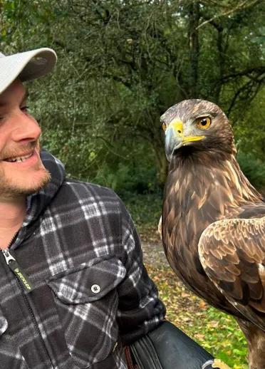 A handler with an eagle.