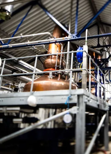 Vats in a gin making distillery.