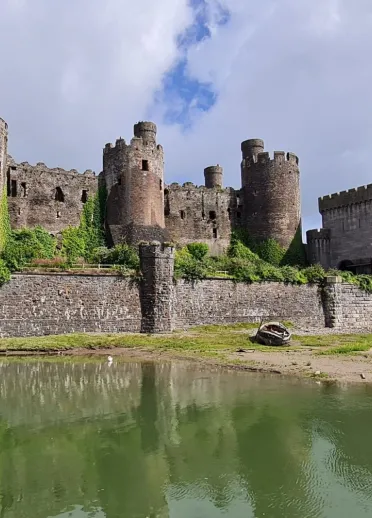 A castle surrounded by a moat.