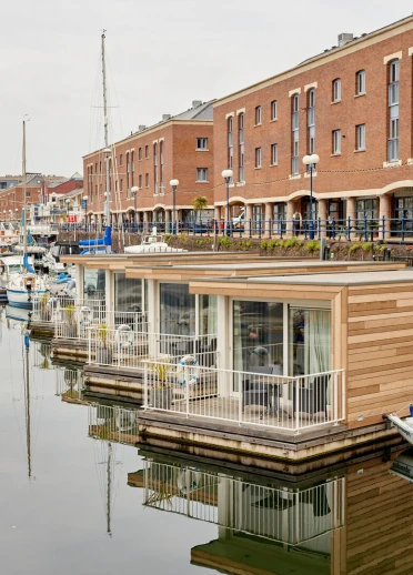 Floating hotel cabins in a marina.