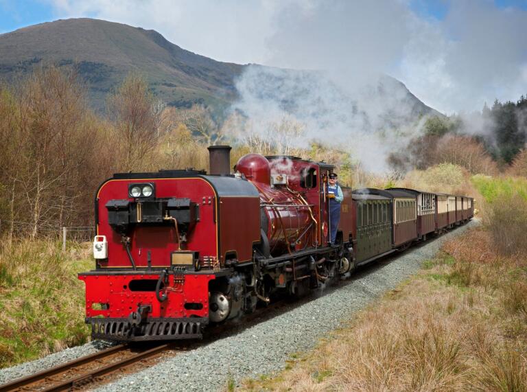 Ffestiniog & Welsh Highland locomotive south of Rhyd Ddu with Mynydd Drws y coed in background.
